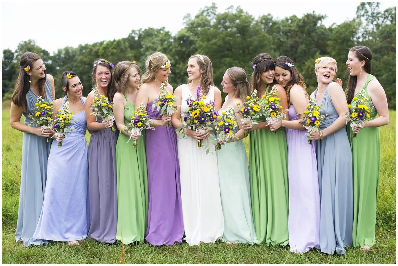 Blackberry Creek Retreat Ozarks Wedding bridal party in mismatched pastel dresses photo