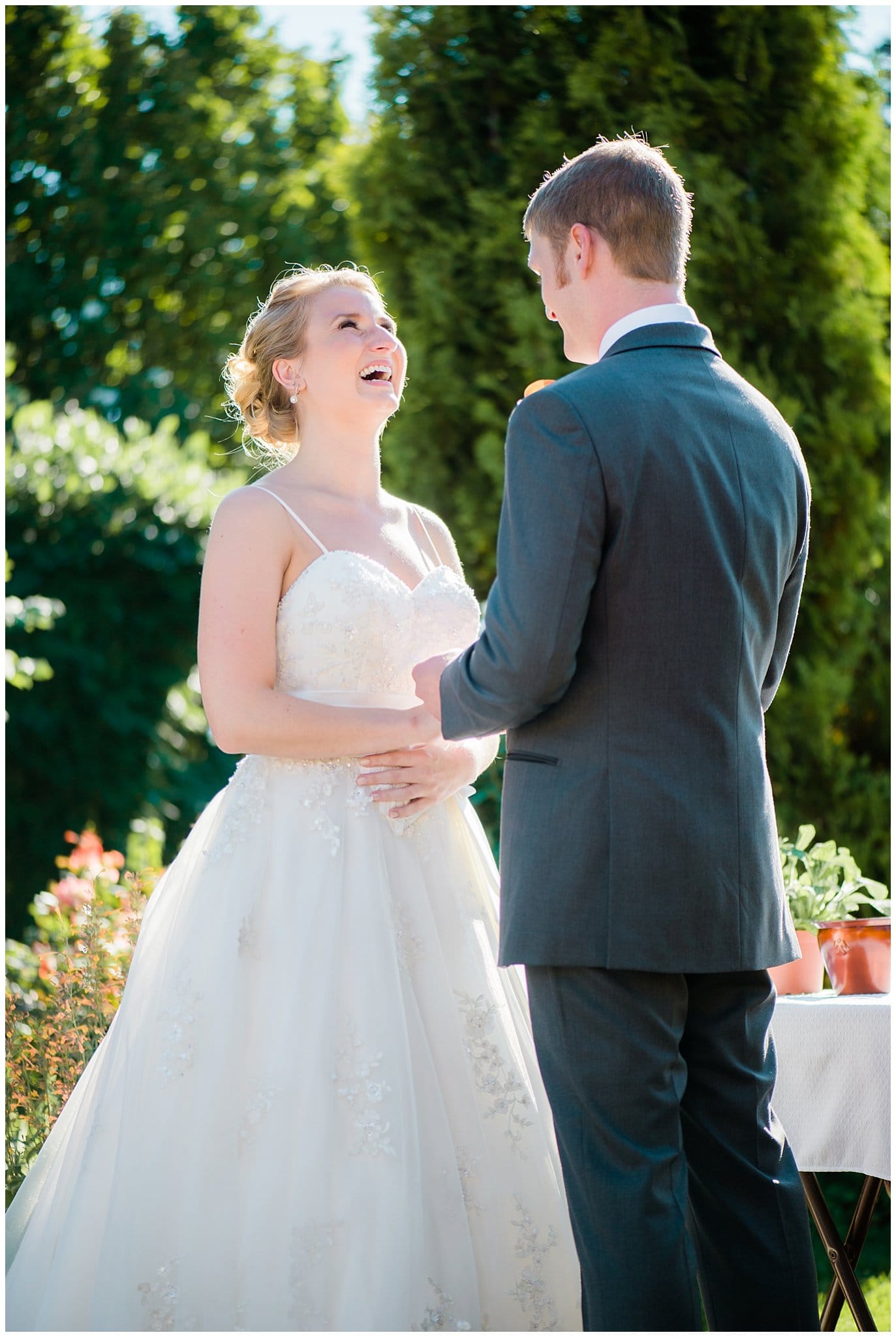bride laughing during vows at Denver Botanic Gardens wedding by Denver wedding photographer Jennie Crate