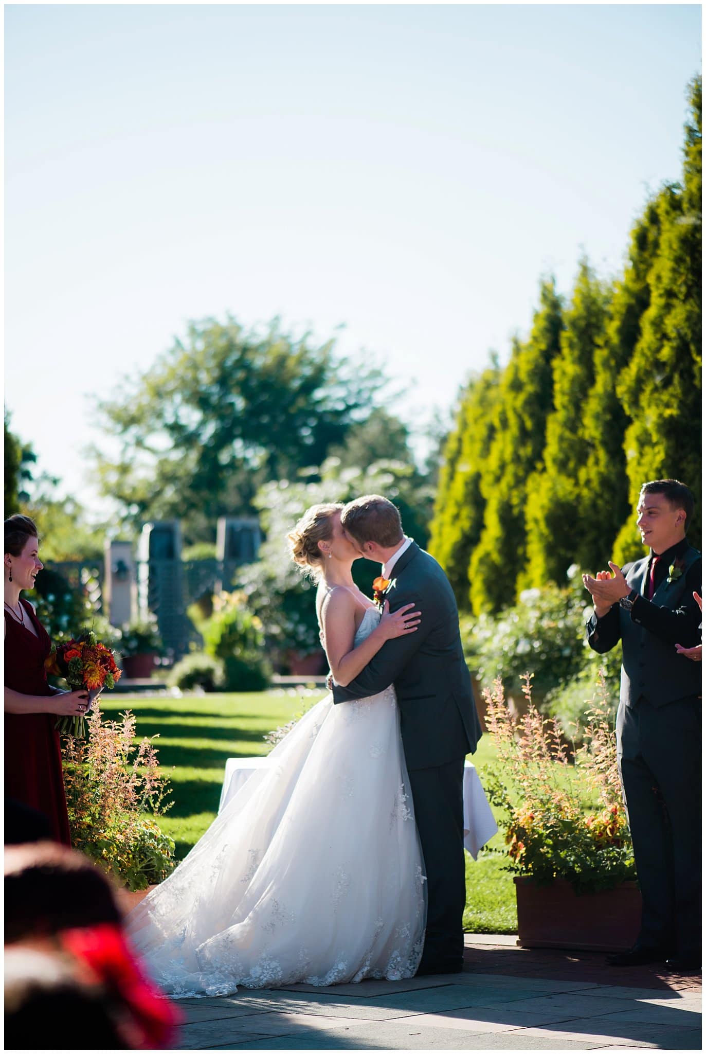 first kiss at Denver Botanic Gardens Romantic Garden at Denver Botanic Gardens wedding by Denver wedding photographer Jennie Crate