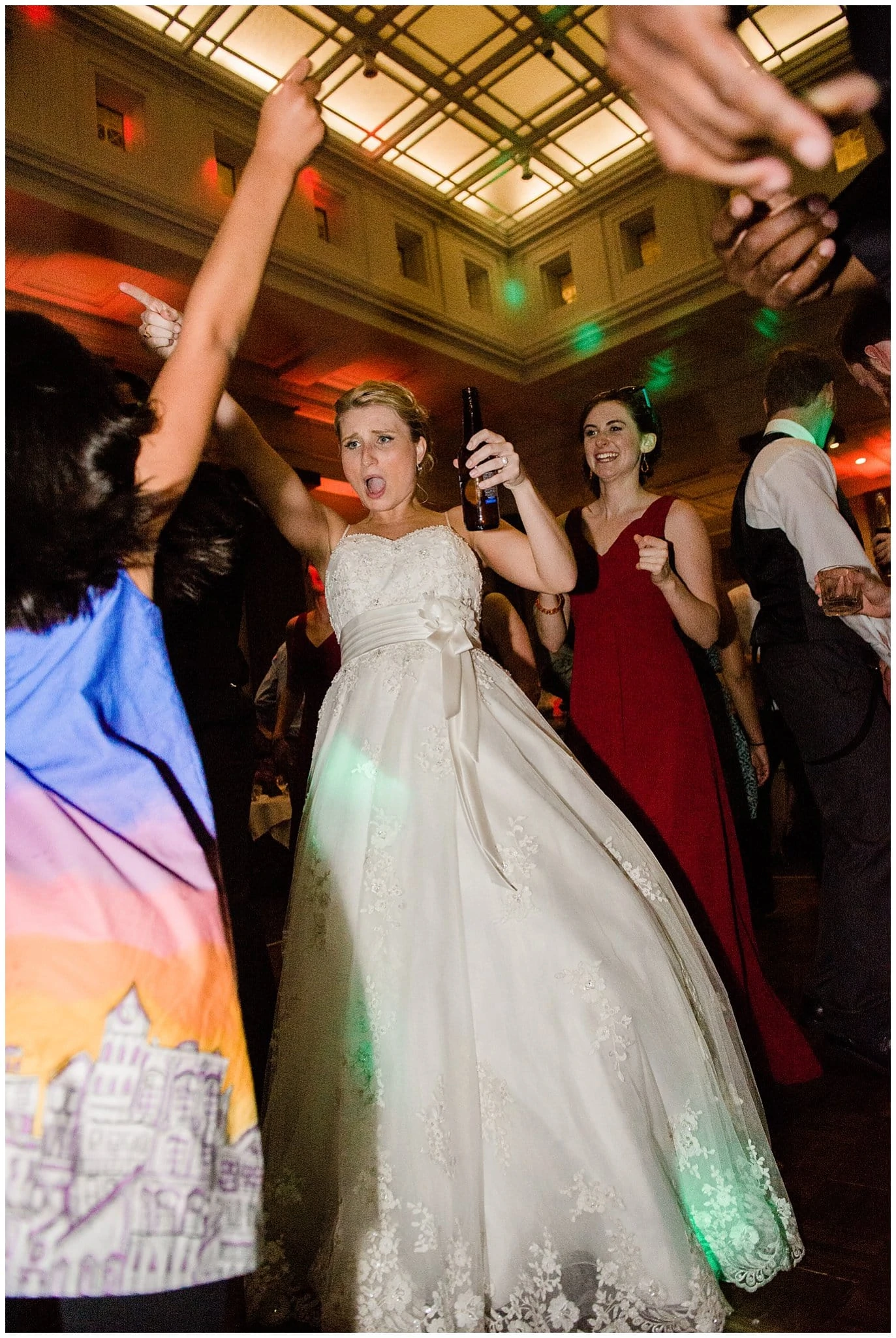 bride dancing at reception at Denver Magnolia Hotel wedding reception by Denver wedding photographer Jennie Crate