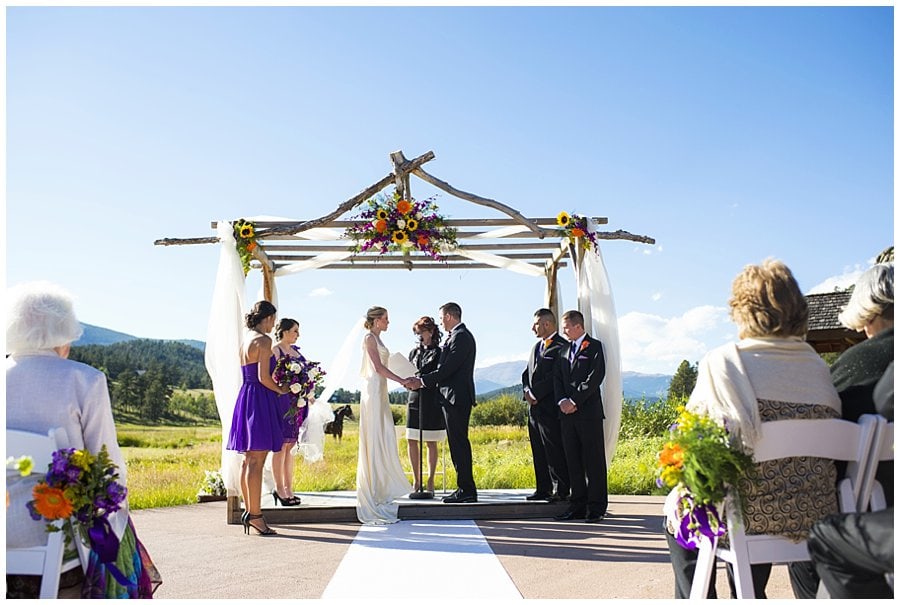 colorful wedding ceremony at Deer Creek Valley Ranch wedding by Colorado wedding photographer Jennie Crate
