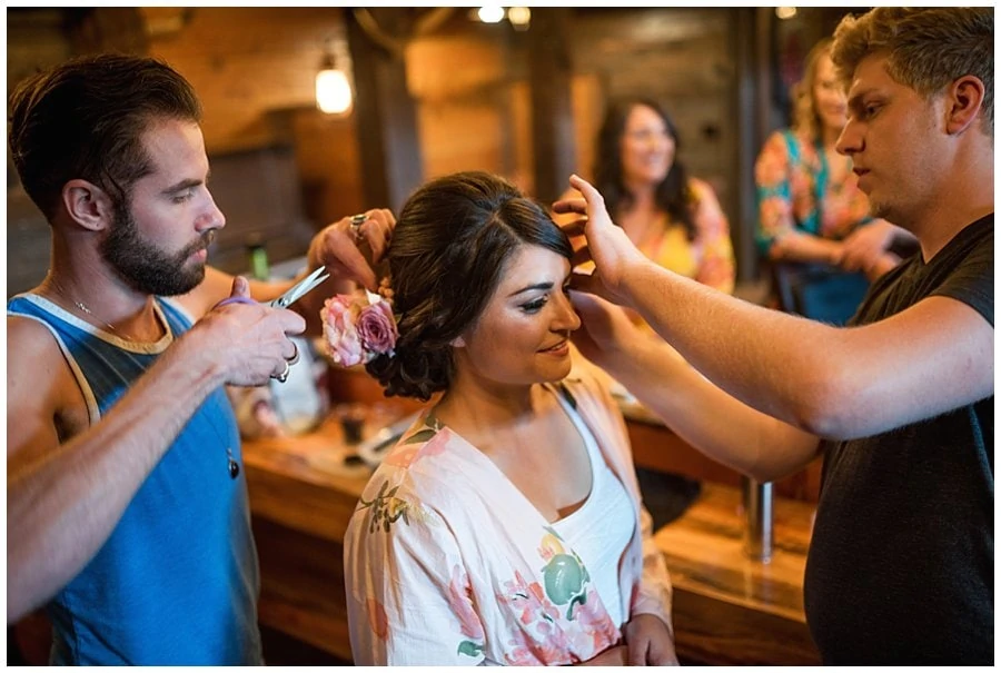 bride getting ready in man cave at Deer Creek Valley Ranch wedding by Denver wedding photographer Jennie Crate
