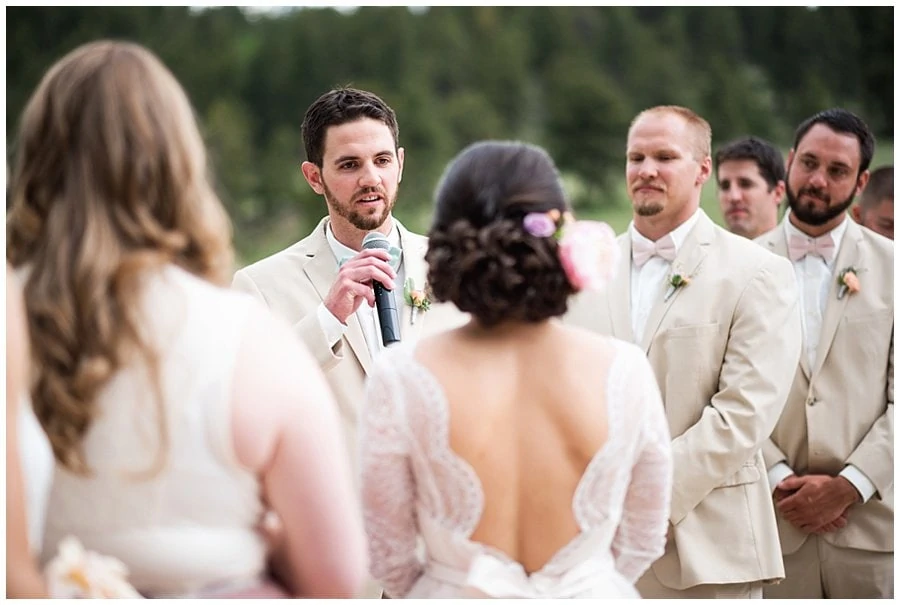 groom saying vows at Deer Creek Valley Ranch wedding by Deer Creek Valley Ranch wedding photographer Jennie Crate