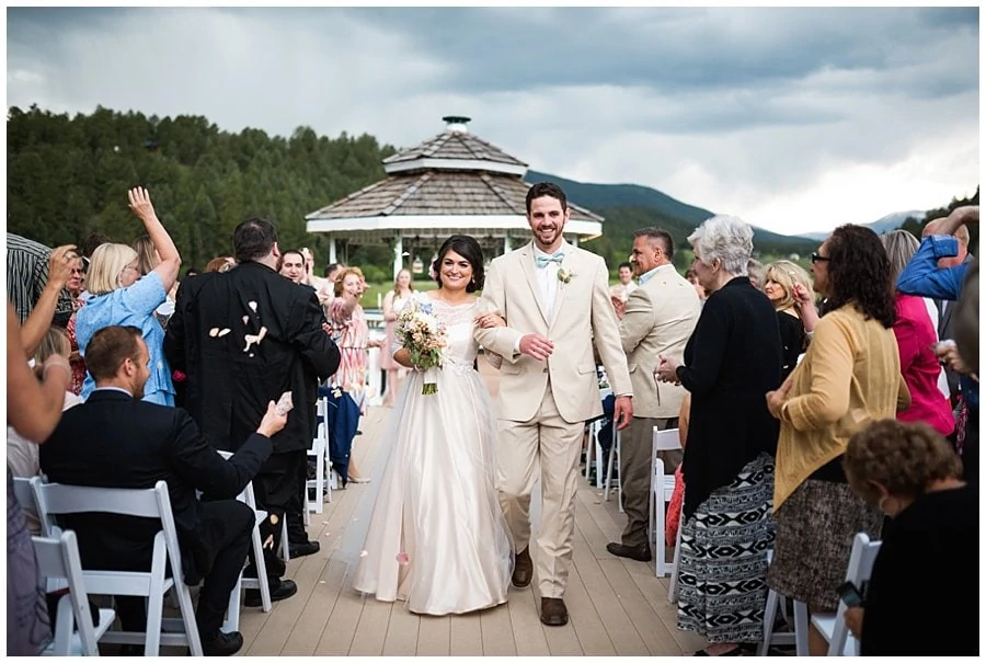 bride and groom walk back down aisle at gazebo ceremony site at Deer Creek Valley Ranch wedding by Deer Creek Valley Ranch wedding photographer Jennie Crate