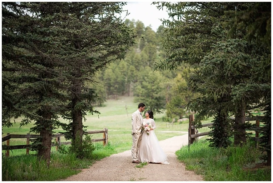bride and groom on tree lined path at Deer Creek Valley Ranch wedding by Deer Creek Valley Ranch wedding photographer Jennie Crate