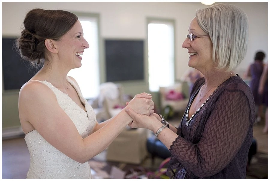 bride and mom excited on wedding day at spring Denver Botanic Gardens at Chatfield Wedding by Denver wedding photographer Jennie Crate