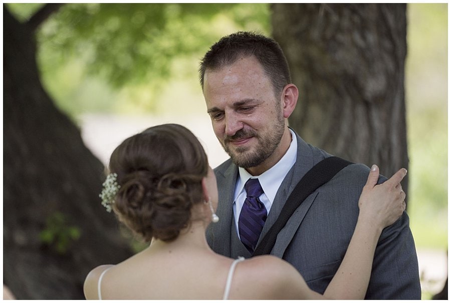 groom cries during first look at spring Denver Botanic Gardens at Chatfield Wedding by Boulder wedding photographer Jennie Crate