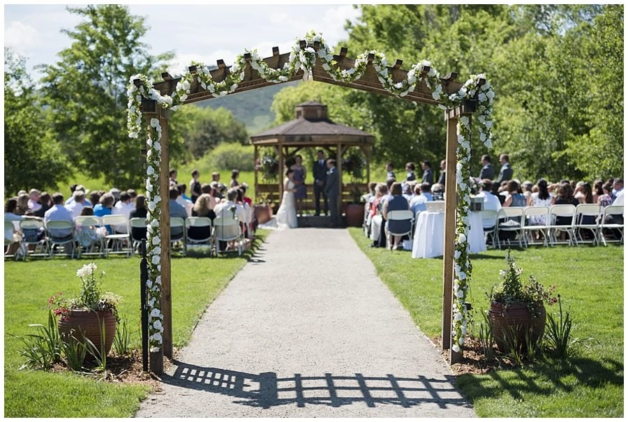 Open Air Chapel wedding ceremony at spring Denver Botanic Gardens at Chatfield Wedding by Denver Botanic Gardens wedding photographer Jennie Crate