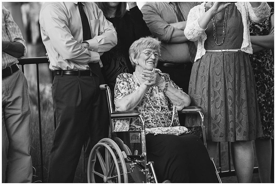 grandma smiling during bride and groom first dance at spring Denver Botanic Gardens at Chatfield Wedding by Lyons wedding photographer Jennie Crate