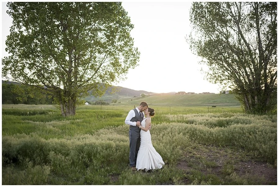 bride and groom at sunset in fields at spring Denver Botanic Gardens at Chatfield Wedding by Lyons wedding photographer Jennie Crate