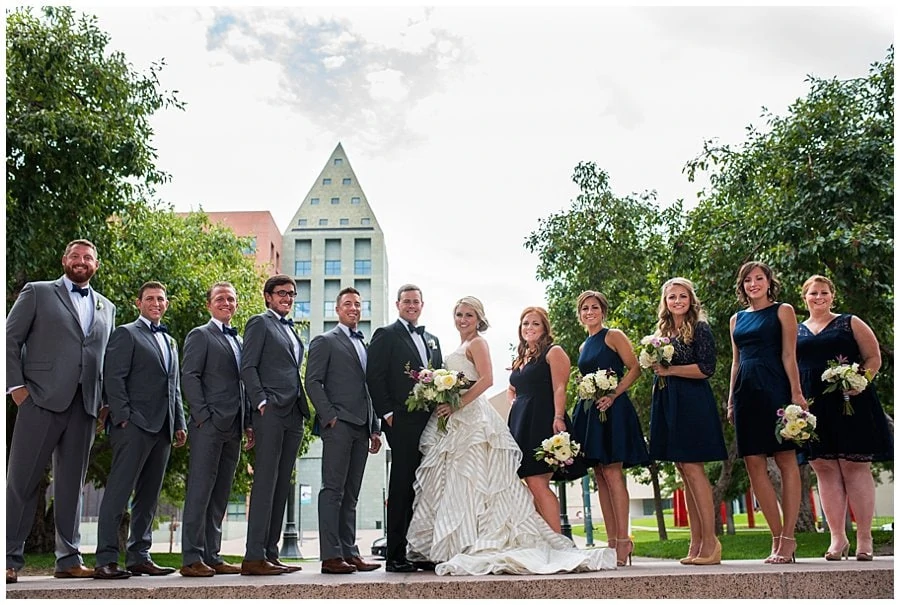 bride and groom and wedding party Civic Center Park before blanc Denver wedding by Boulder Wedding Photographer Jennie Crate Photographer