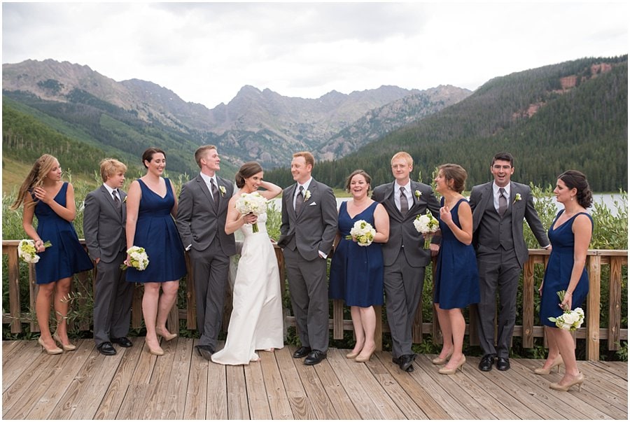  bridal party in navy dresses and grey suits at Piney River Ranch wedding by Vail Wedding photographer Jennie Crate, Photographer