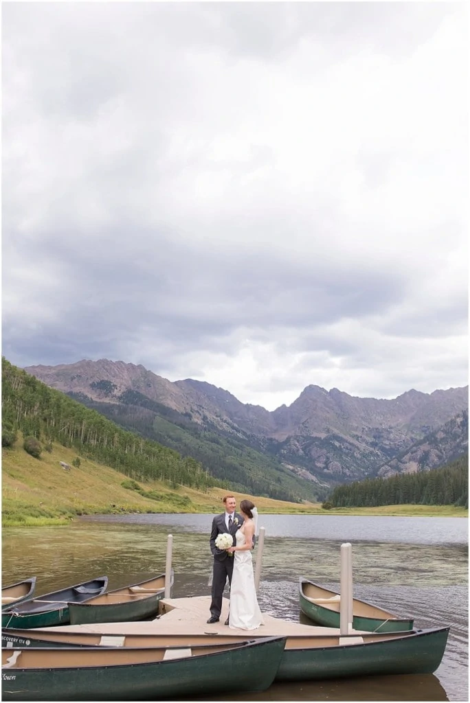 romantic couples portrait on dock at Piney River Ranch wedding by Colorado Wedding photographer Jennie Crate, Photographer