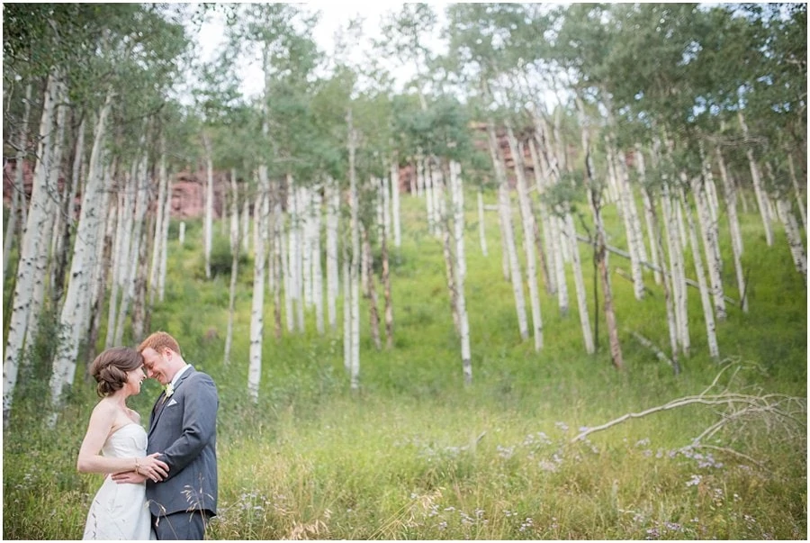 bride and groom romantic photo in colorado aspen at Piney River Ranch wedding by Colorado Wedding photographer Jennie Crate, Photographer