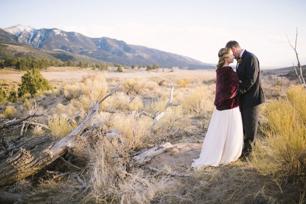 bride and groom eloping at Great Sand Dunes National Park by Vail Wedding Photographer Jennie Crate, Photographer