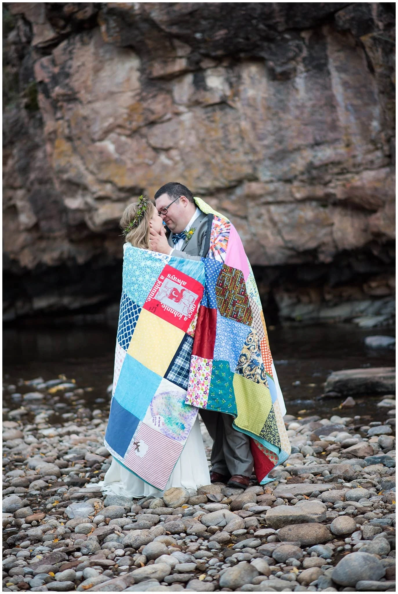 intimate couple wrapped in homemade quilt at Lyons Riverbend wedding by Boulder wedding photographer Jennie Crate