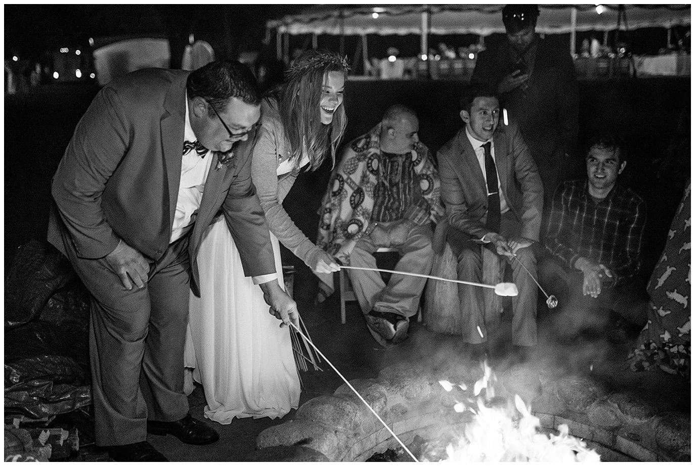 roasting s'mores by firepit cozy outdoor colorado mountain wedding reception at Lyons Riverbend wedding by Denver wedding photographer Jennie Crate