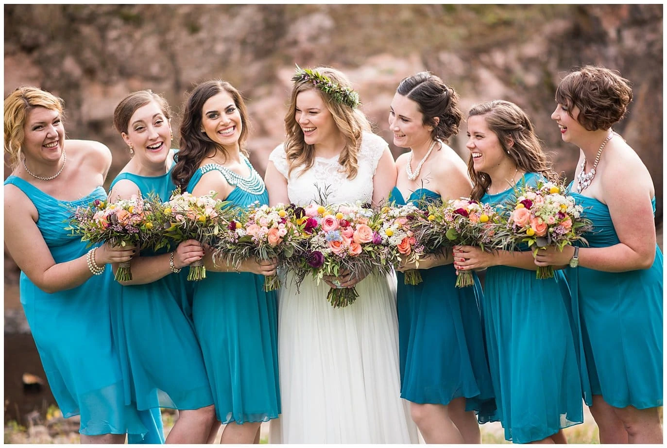 bridal party in teal bridesmaids dresses at Lyons Riverbend wedding by Lyons wedding photographer Jennie Crate