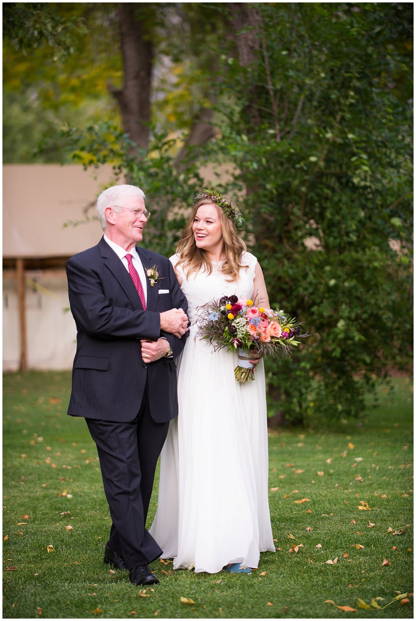 bride and dad walking down aisle at Lyons Riverbend wedding by Boulder wedding photographer Jennie Crate