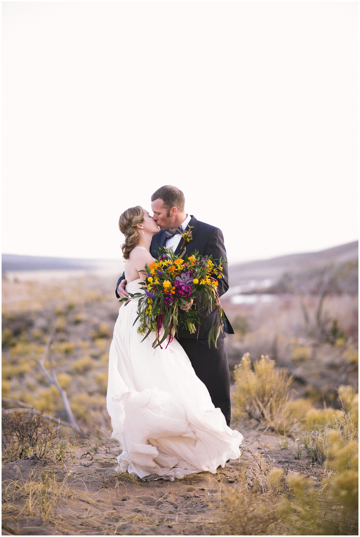 wedding dress blowing in wind colorado sand dunes photo