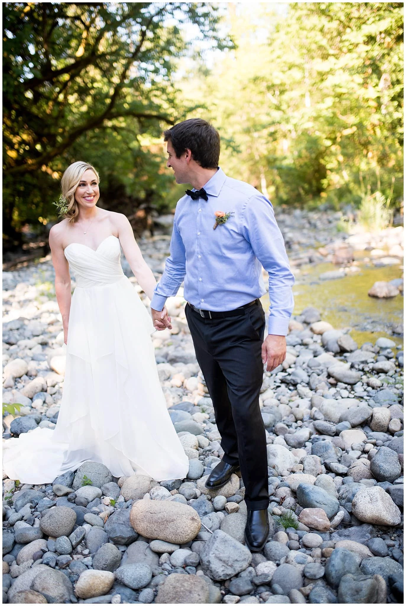 couple by river in washington elopement photo