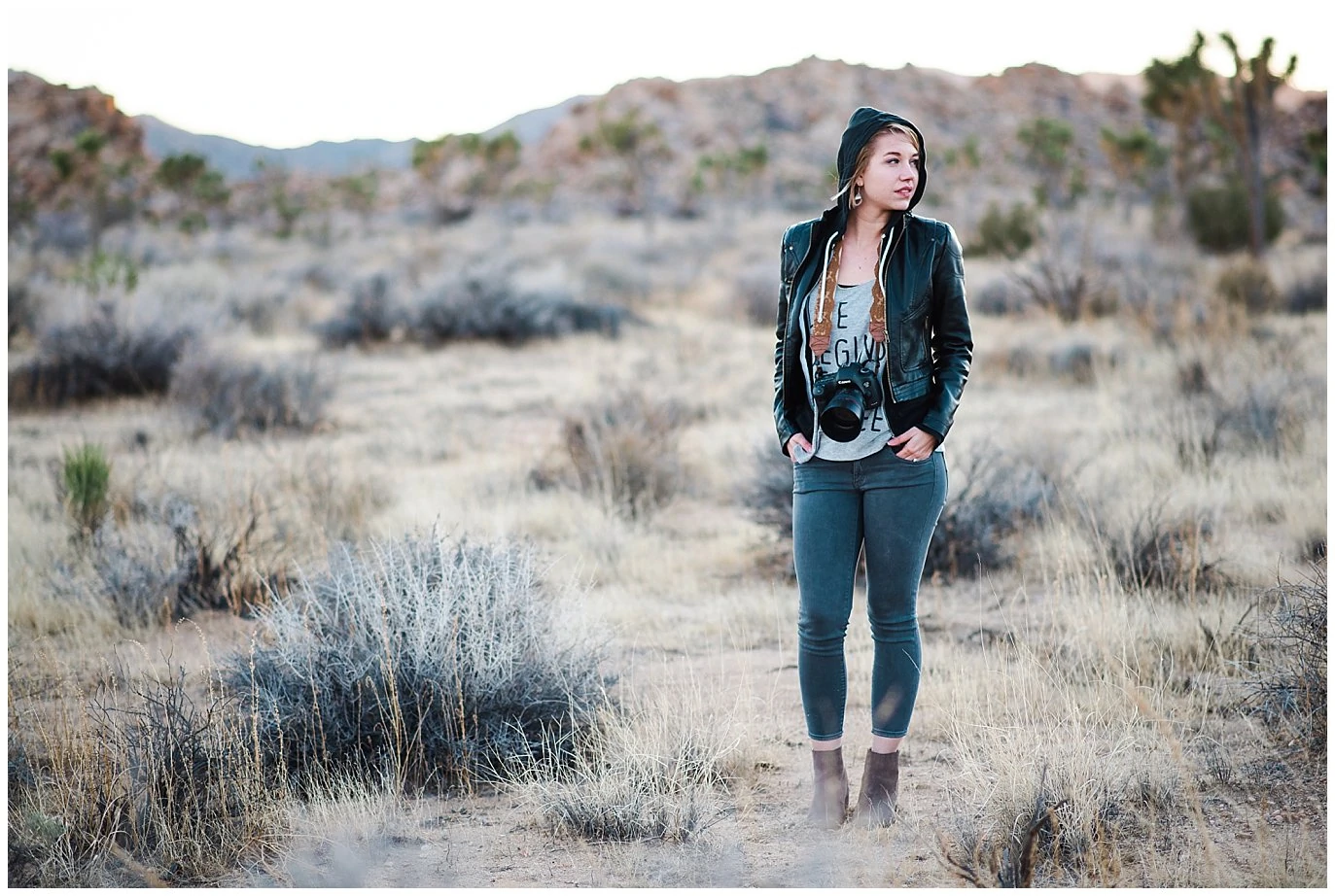 girl with leather jacket in desert photo