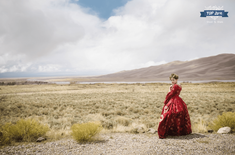 Great Sand Dunes National Park woman in red historical costume photo