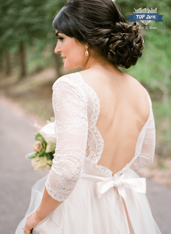 bride with scalloped back lace dress