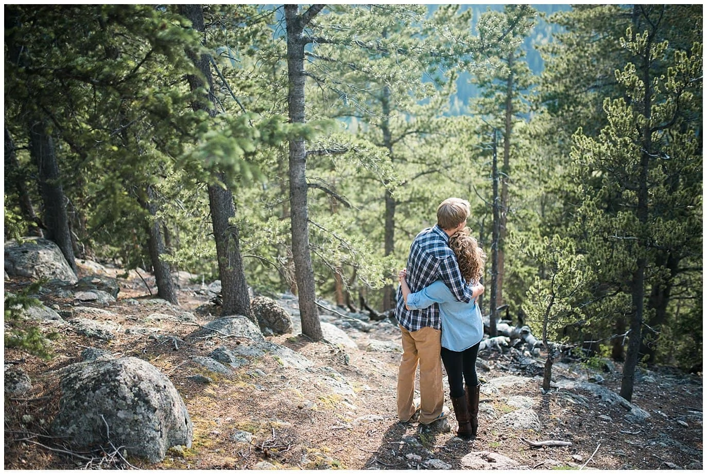 couple in mountains with evergreens photo