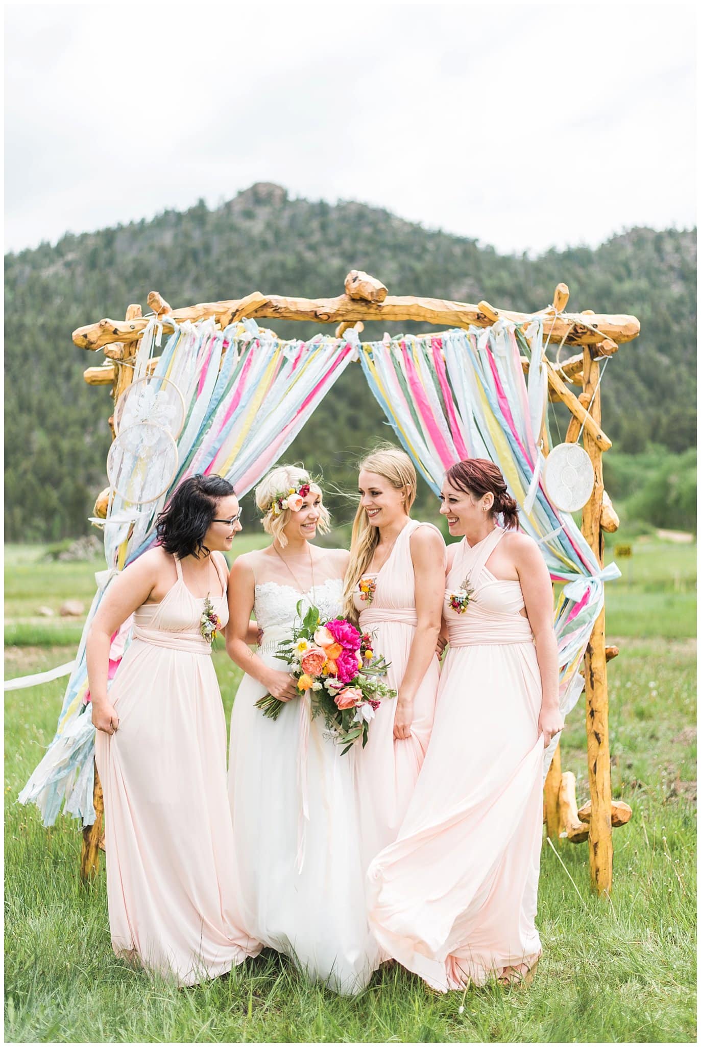 bridal party in pink stretch dresses photo