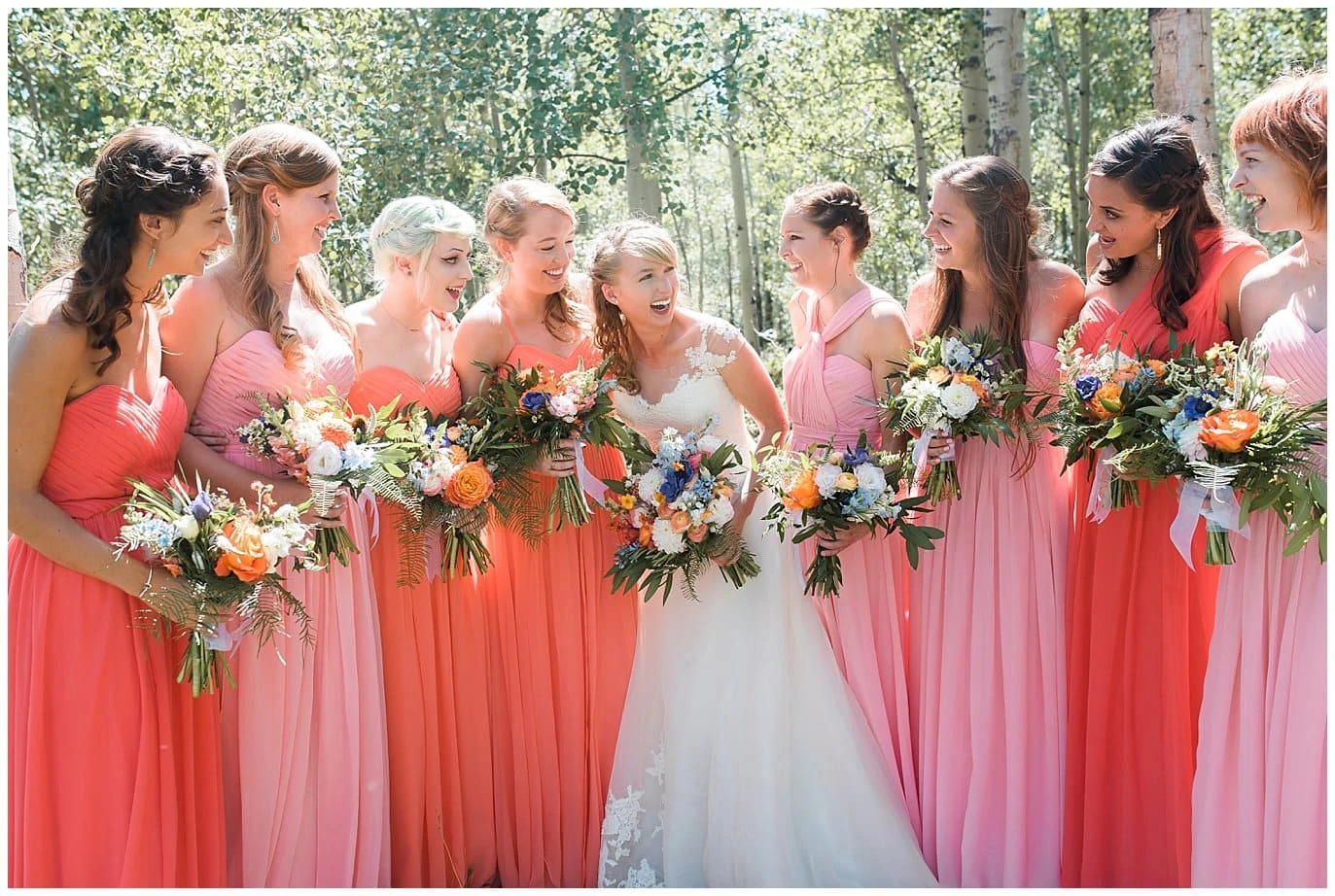 bridesmaids in shades of coral photo