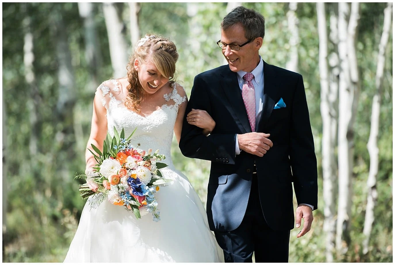 bride walking down aisle with father at Granby Ranch wedding photo