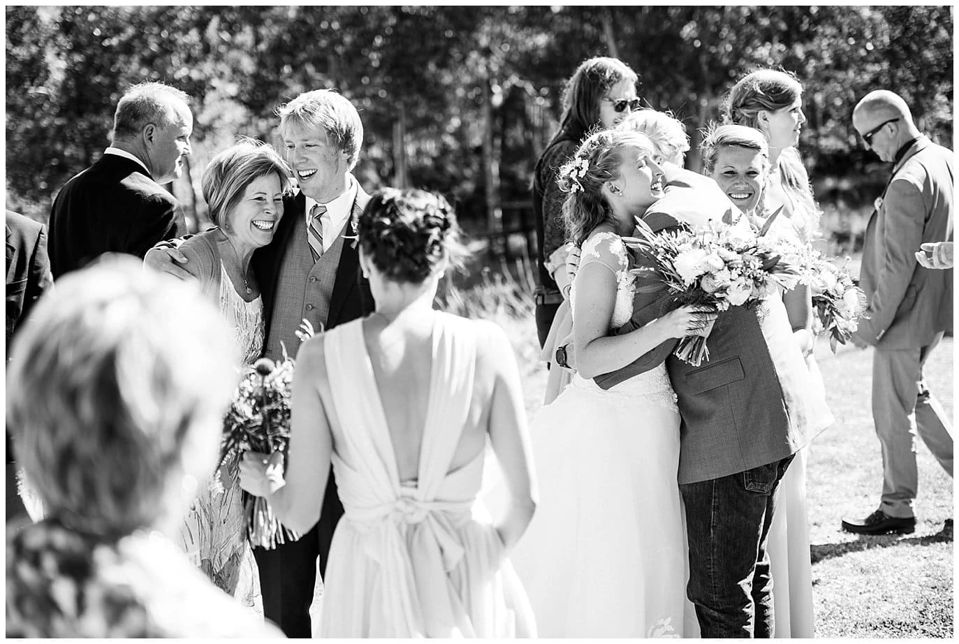 family hugs wedding photojournalism colorado mountain wedding photo