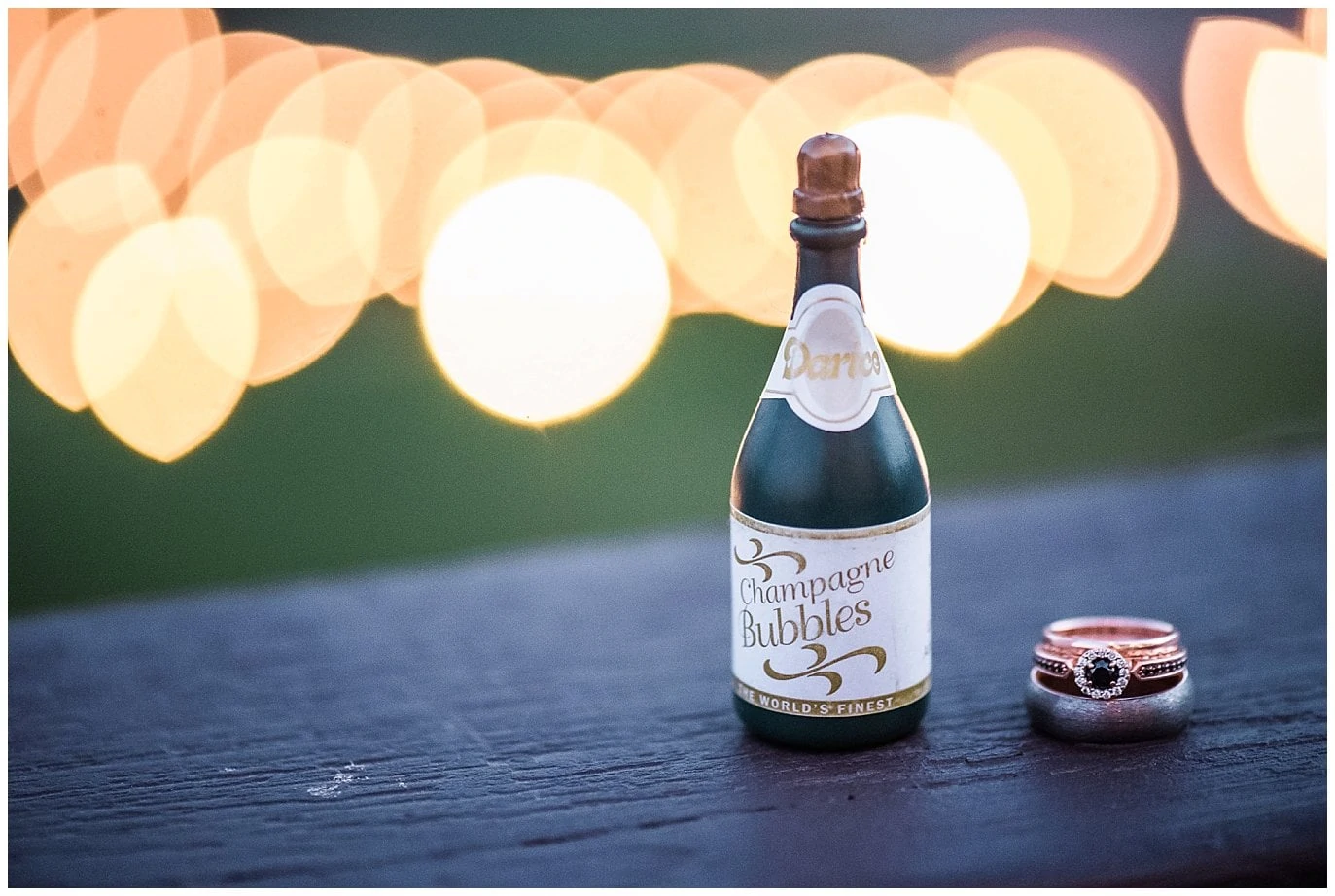 black engagement ring with mini champagne bottle photo
