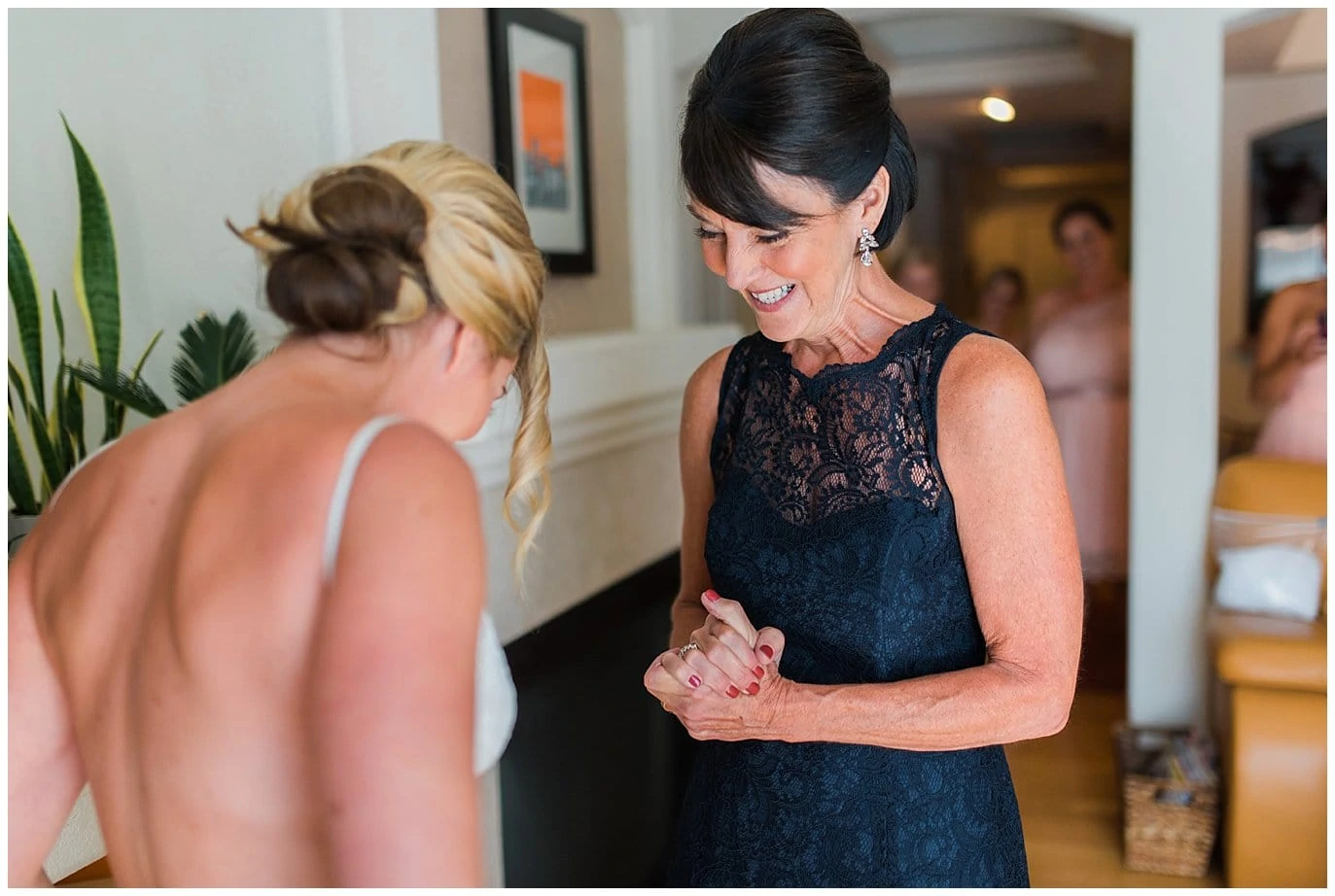 bride excited to put on wedding dress photo