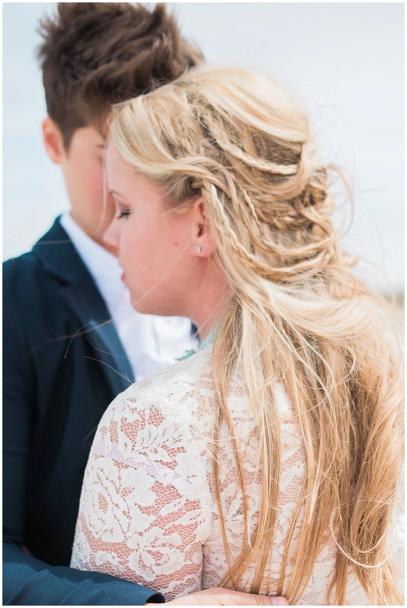 intimate photo of bride's hair with braids photo