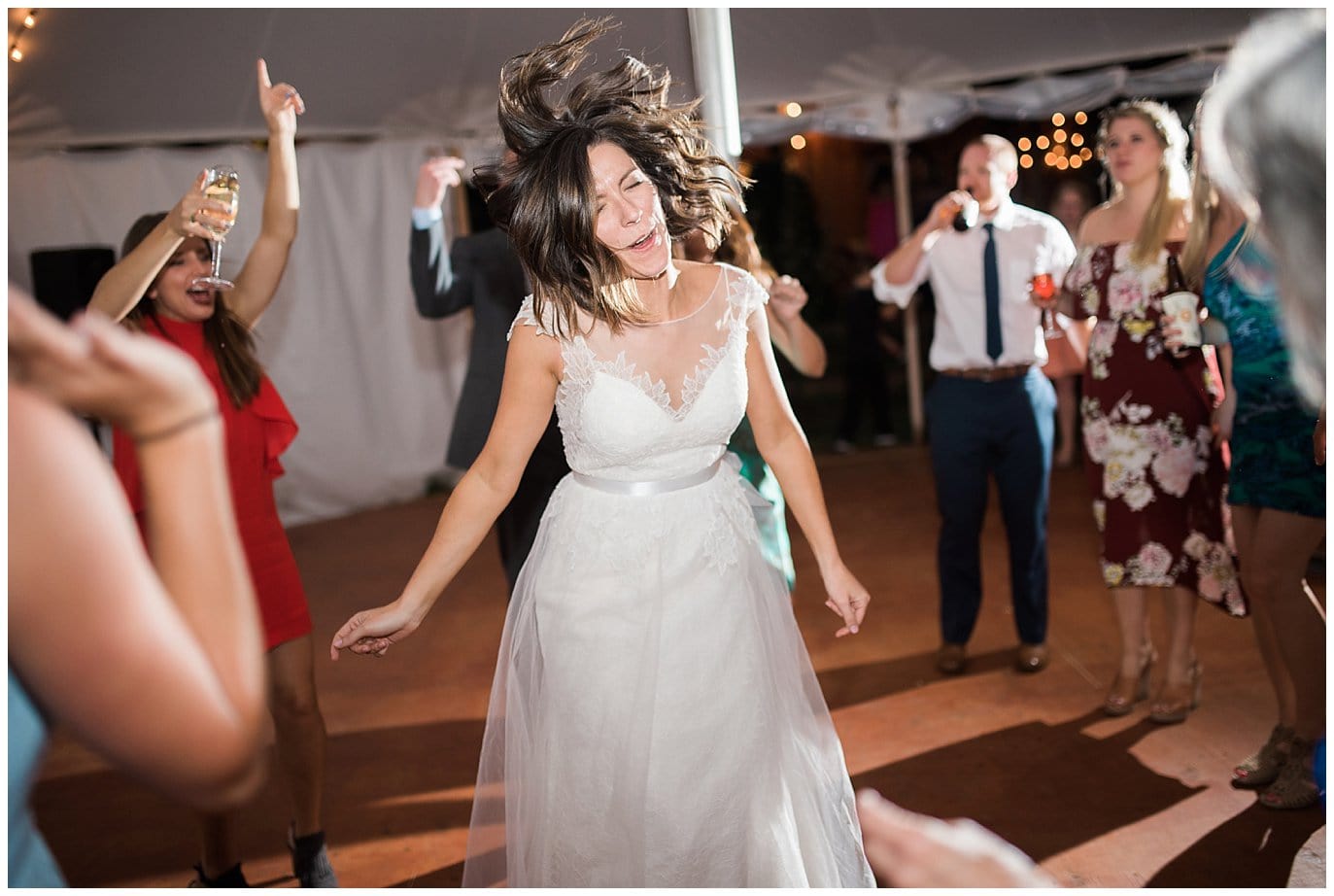 crazy dancing bride at Lyons Farmette wedding by Denver Wedding Photographer Jennie Crate