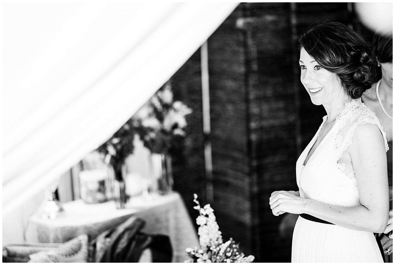 bride getting ready in glamping tent photo