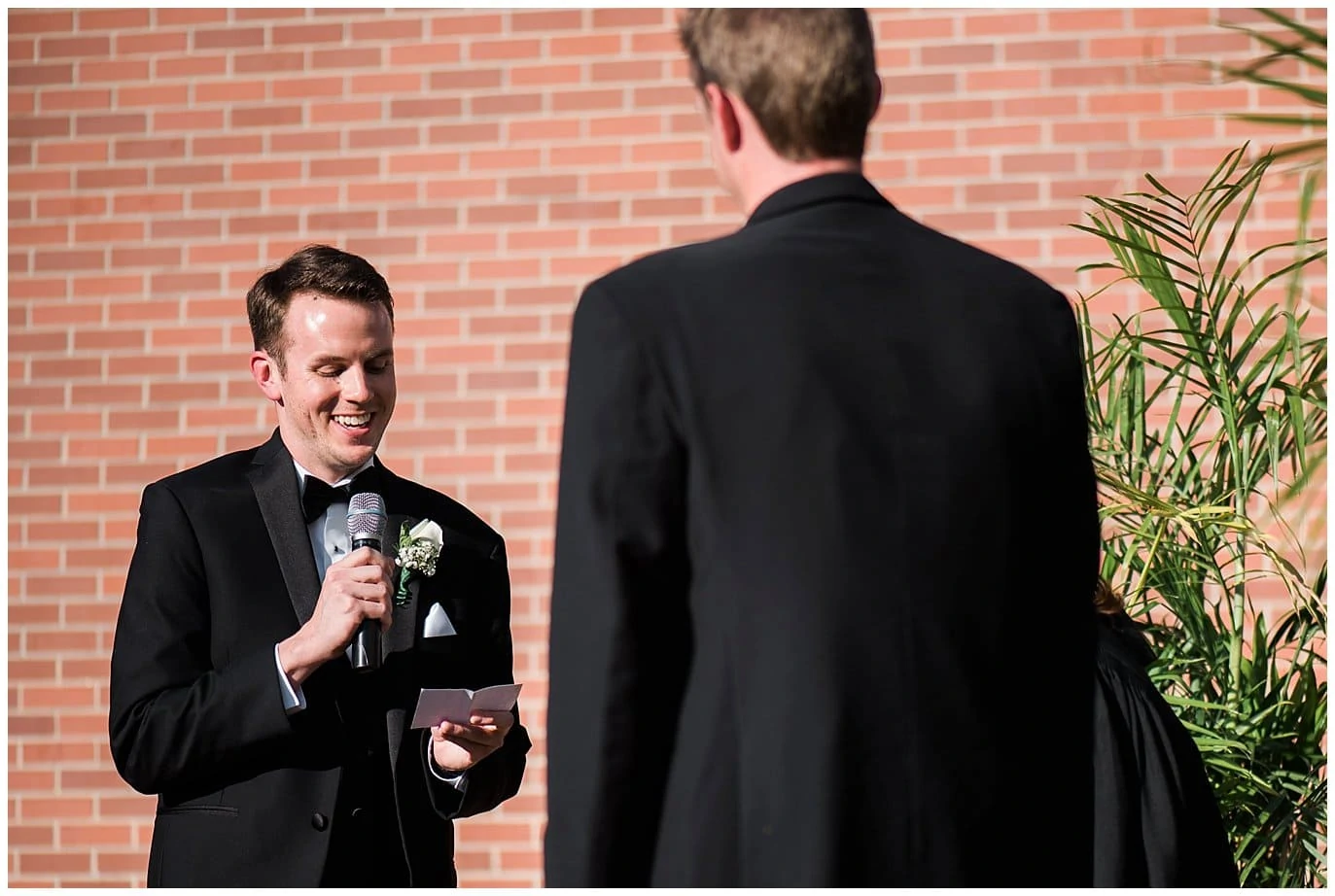grooms saying vows to each other in downtown Denver