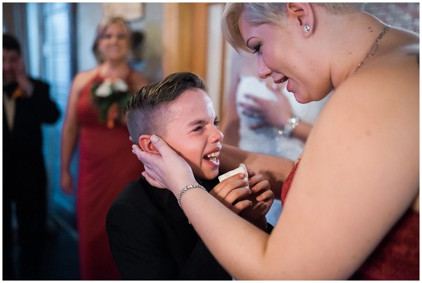 kid crying at mom's wedding photo