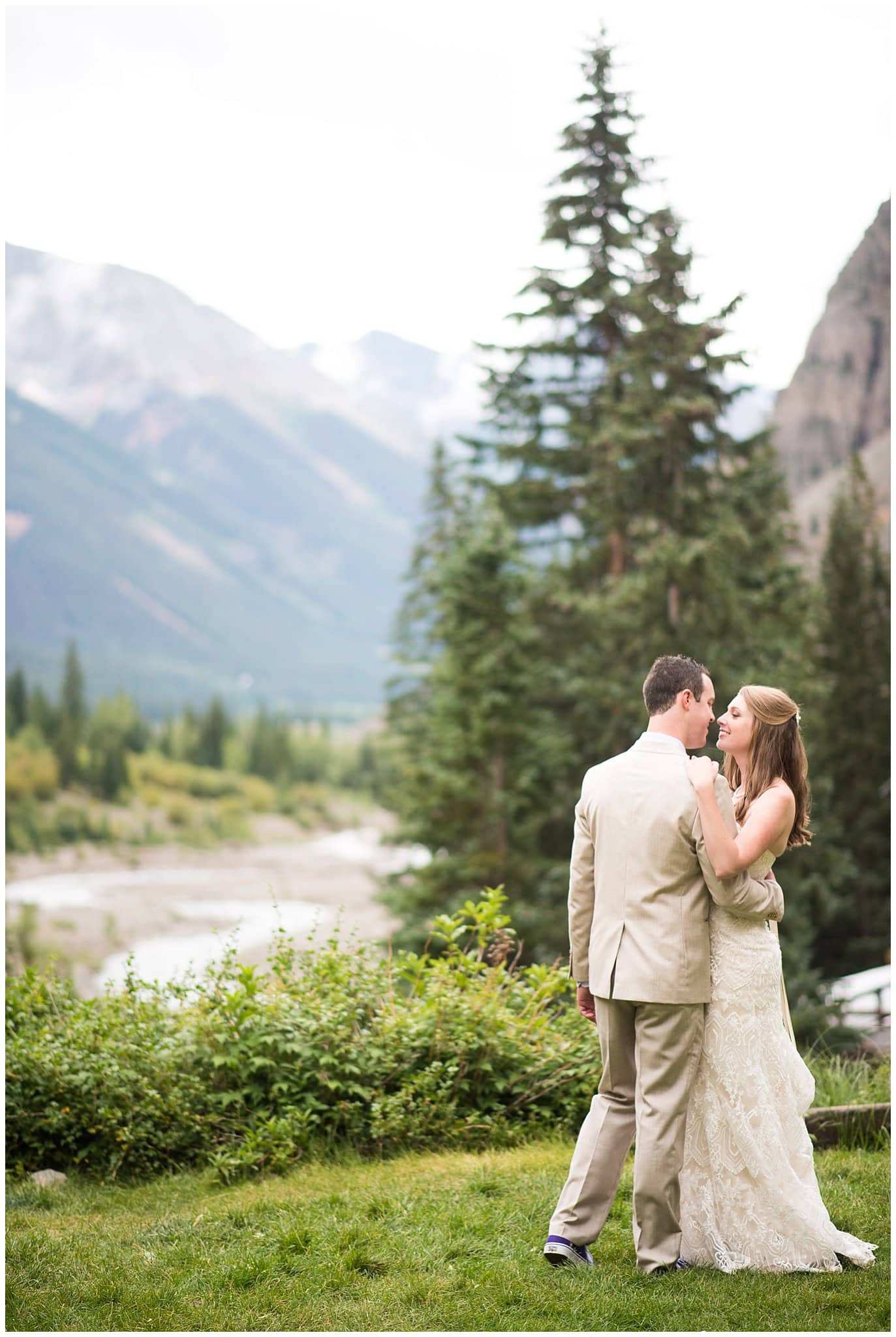 bride and groom overlooking silverton river at Eureka Lodge Wedding by Silverthorne Wedding Photographer Jennie Crate