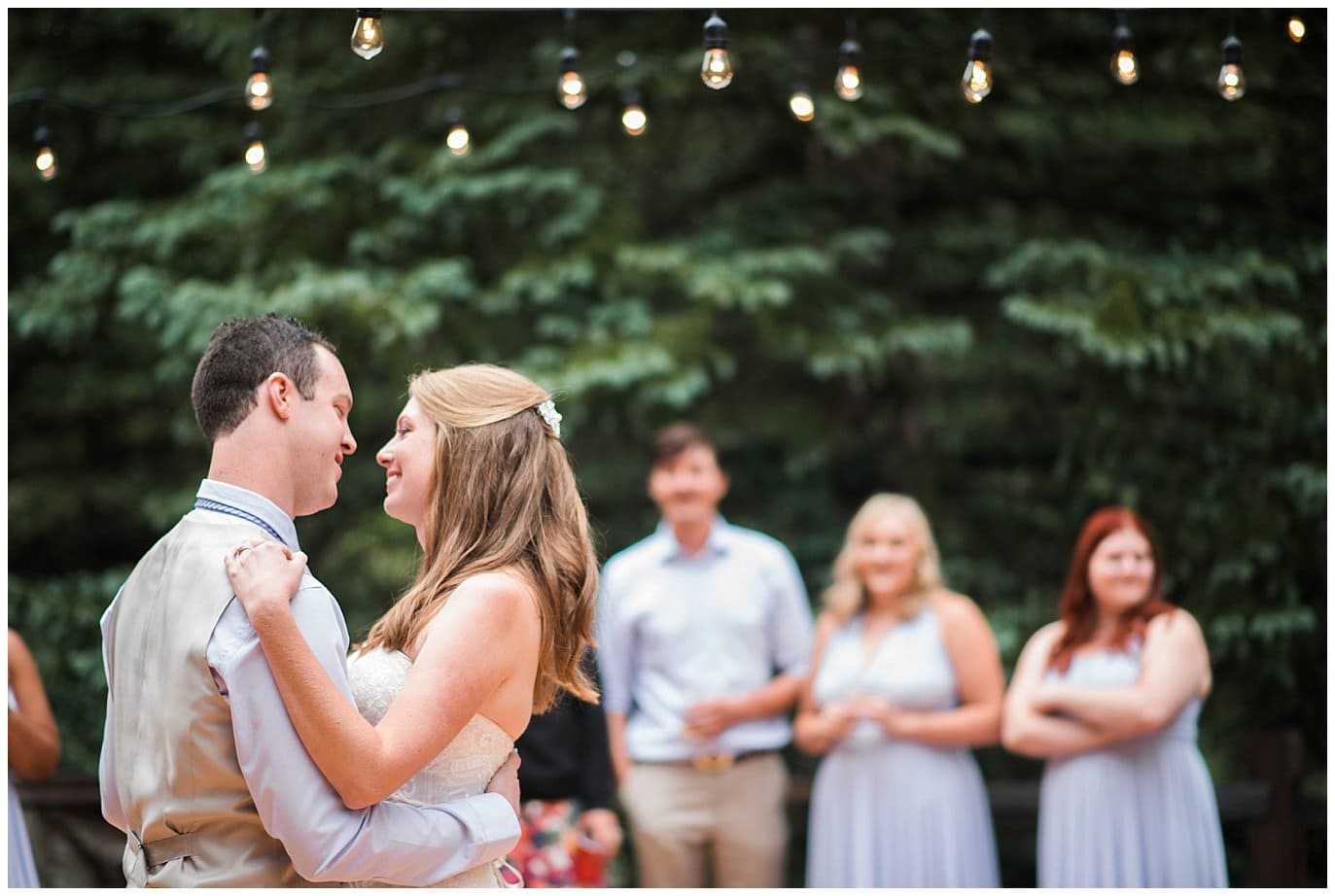 first dance under the market lights at Eureka Lodge Wedding by Frisco Wedding Photographer Jennie Crate