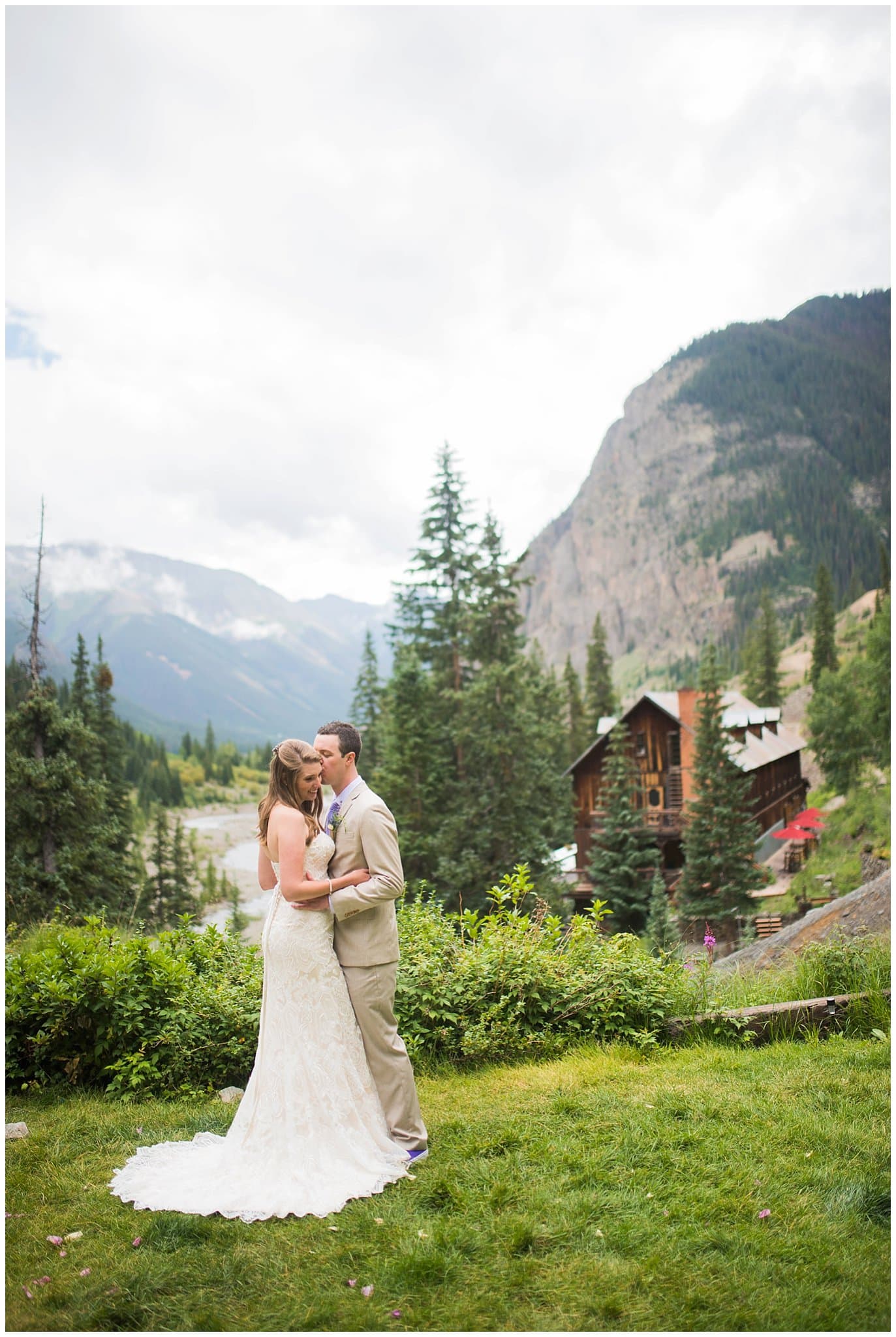 Bride and groom overlooking lodge at Eureka Lodge Wedding by Silverthorne Wedding Photographer Jennie Crate