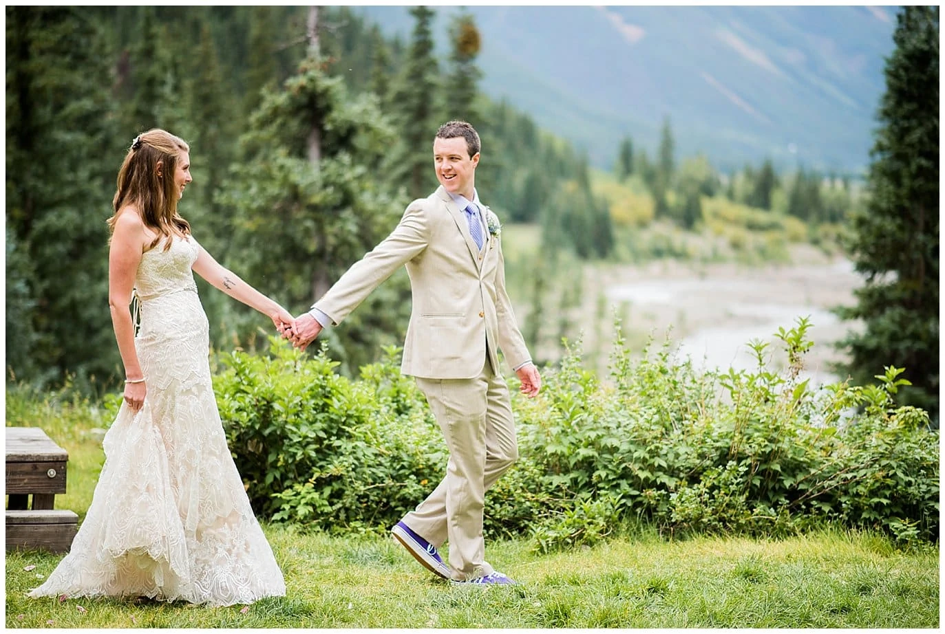 bride and groom walking on mountain at Eureka Lodge Wedding by Dillon Wedding Photographer Jennie Crate