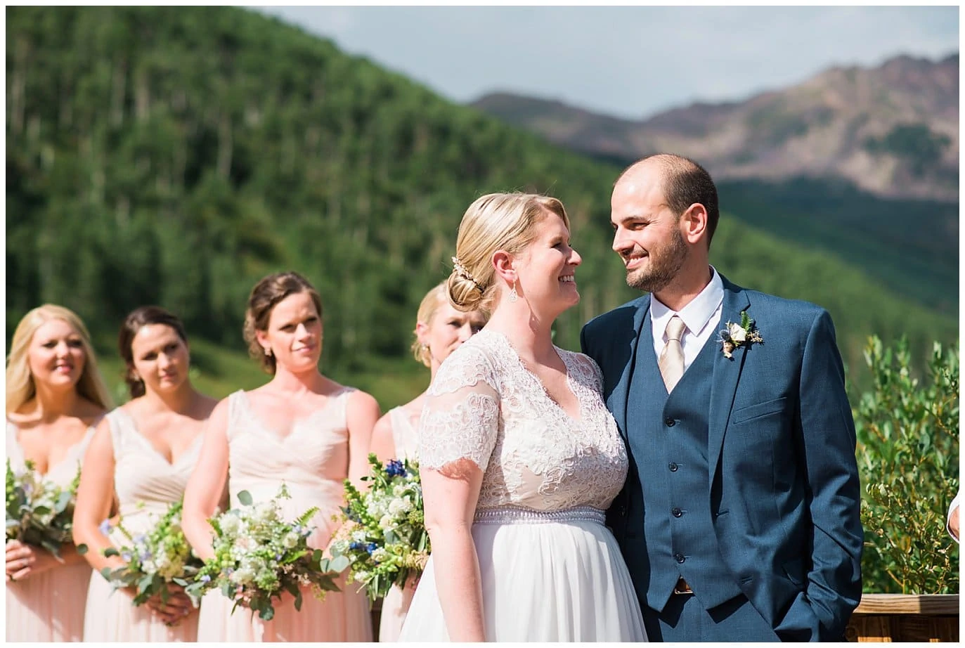 bride and groom looking at each other during wedding ceremony at Piney River Ranch wedding by Vail wedding photographer Jennie Crate photographer
