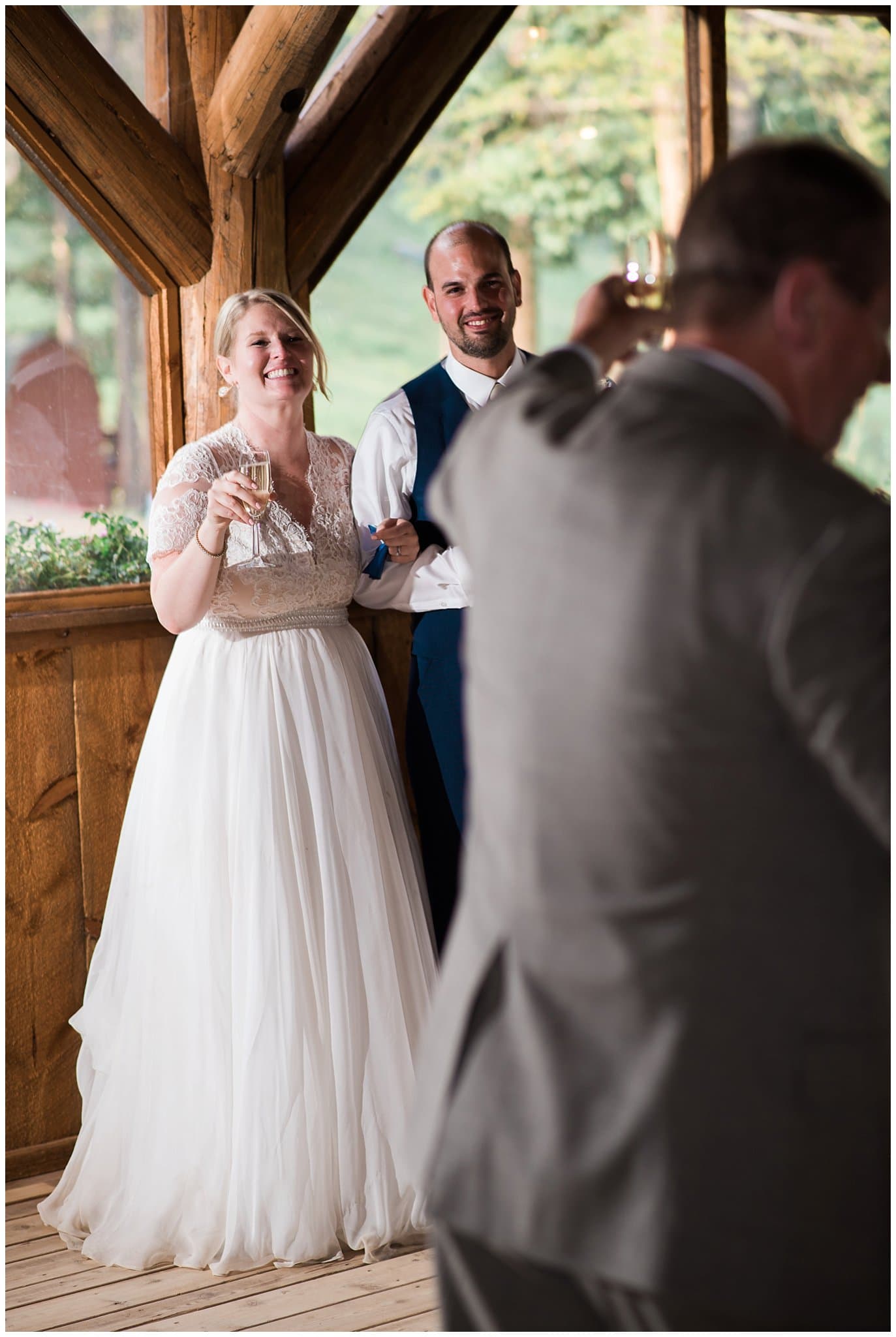 toasts during wedding reception at Piney River Ranch wedding by Vail wedding photographer Jennie Crate photographer