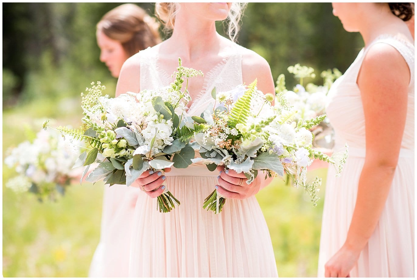 wildflower bouquets and blush bridesmaid dresses at Piney River Ranch wedding by Beaver Creek Wedding photographer Jennie Crate, Photographer