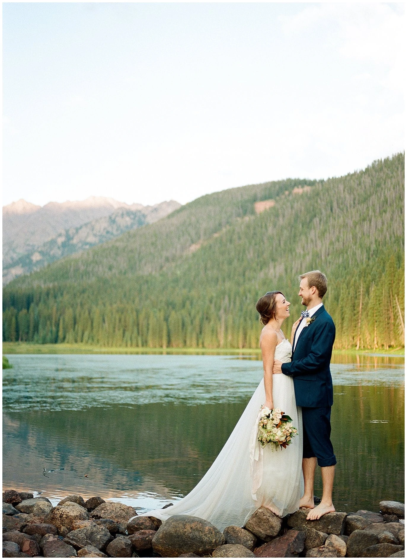 bride and groom laughing barefoot wedding at Piney River Ranch intimate wedding by Aspen wedding photographer Jennie Crate Photographer