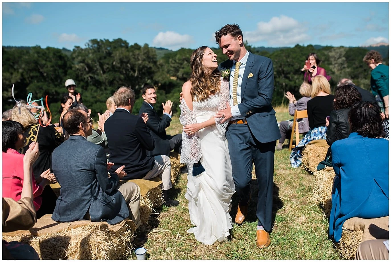 bride and groom walk back down the aisle after wedding ceremony at Mann Family Farm wedding by California wedding photographer Jennie Crate