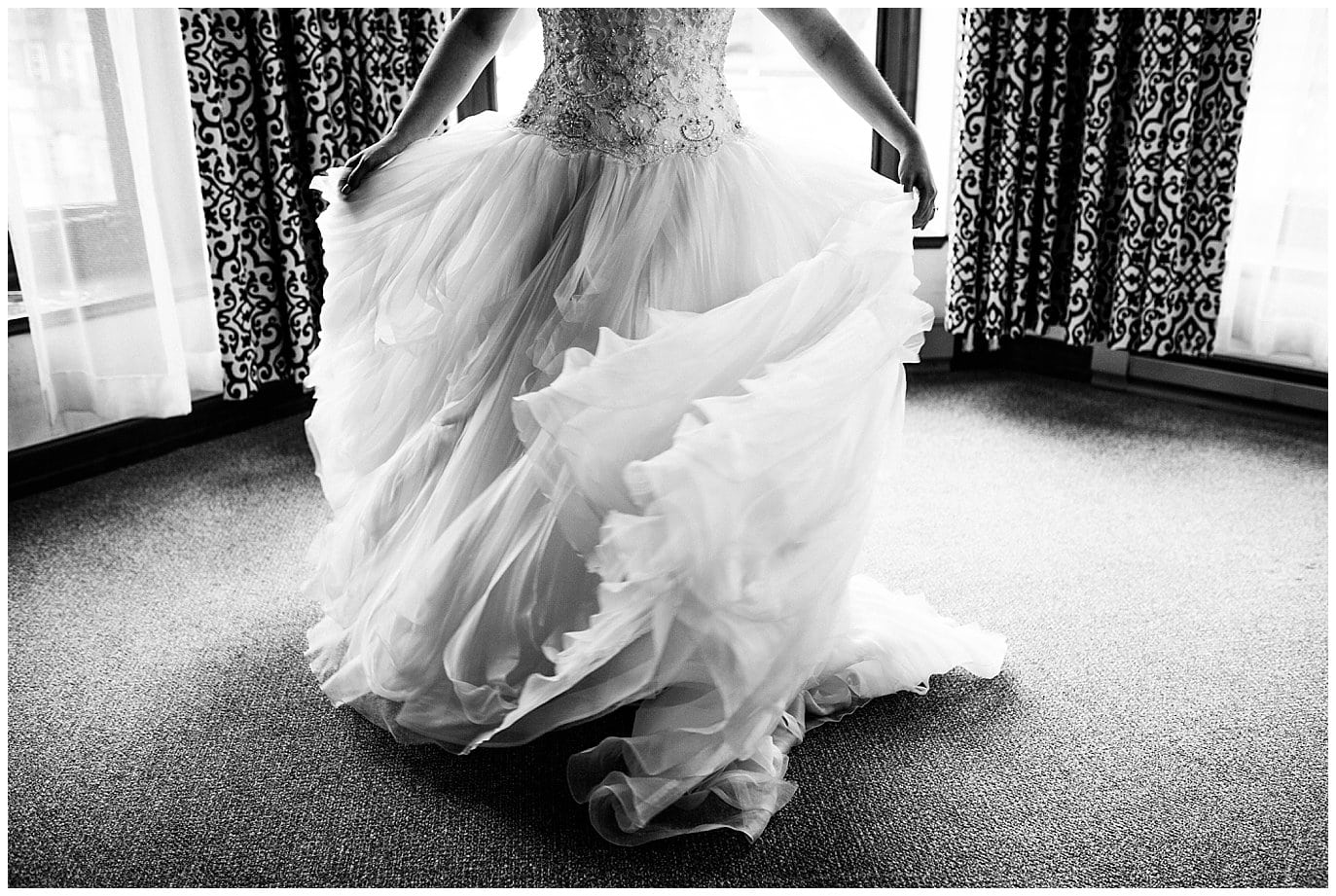 bride twirling in ballgown photo